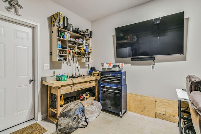 office featuring a workshop area and concrete floors