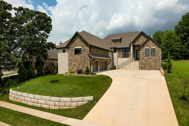 view of front of property featuring a front yard and a garage