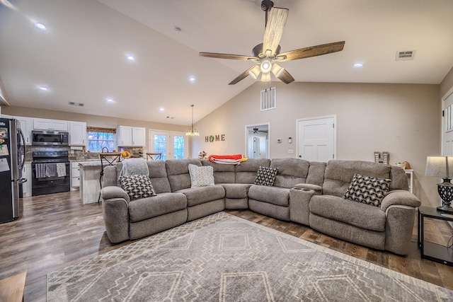 living room with high vaulted ceiling, hardwood / wood-style flooring, and ceiling fan