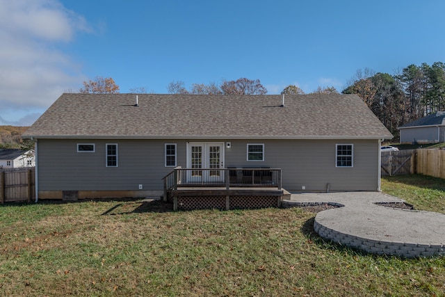 back of house featuring a yard and a deck