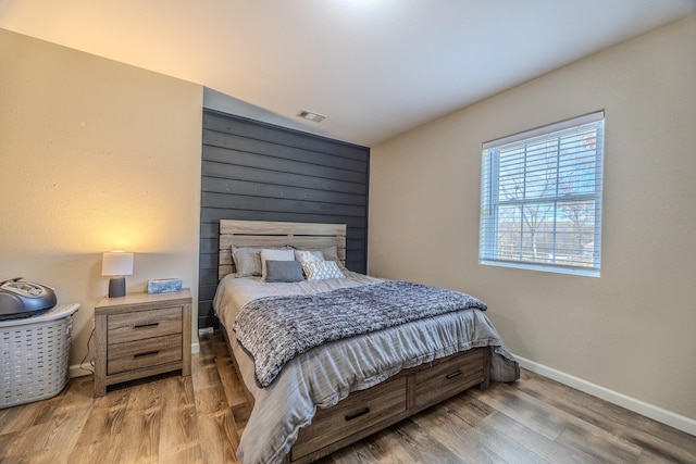 bedroom with wood-type flooring