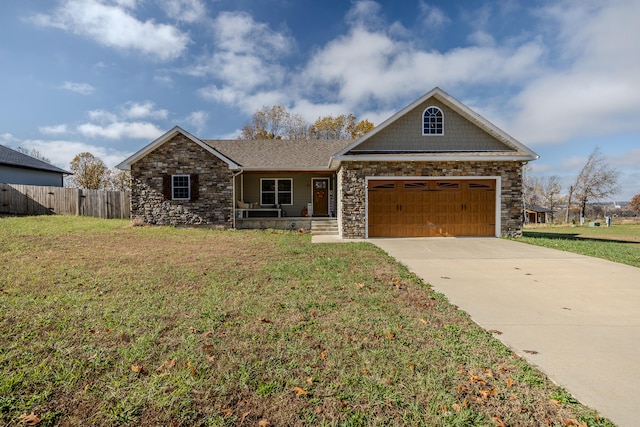 view of front of property featuring a garage and a front lawn