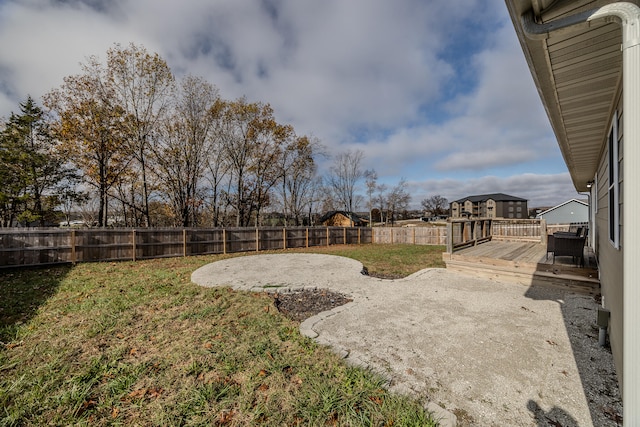 view of yard with a deck and a patio area