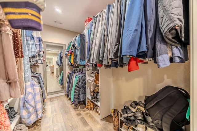 walk in closet featuring wood-type flooring