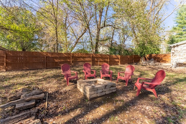 view of yard featuring an outdoor fire pit