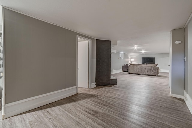 unfurnished living room with hardwood / wood-style flooring