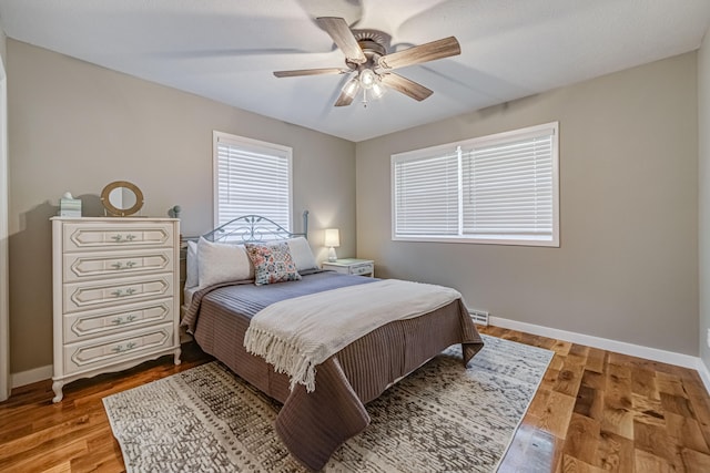 bedroom featuring ceiling fan and light hardwood / wood-style flooring