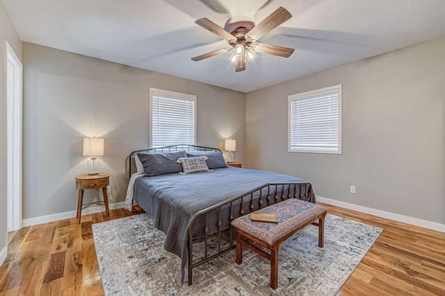 bedroom featuring hardwood / wood-style flooring and ceiling fan