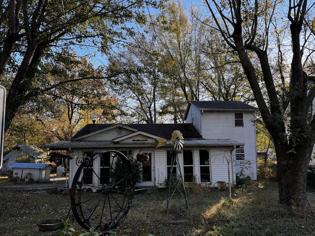 view of front of property with a storage unit