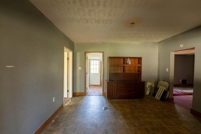 interior space featuring a textured ceiling