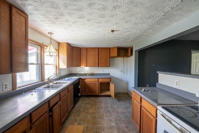 kitchen with a textured ceiling, sink, pendant lighting, and electric range