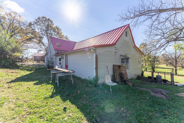 view of property exterior featuring a yard