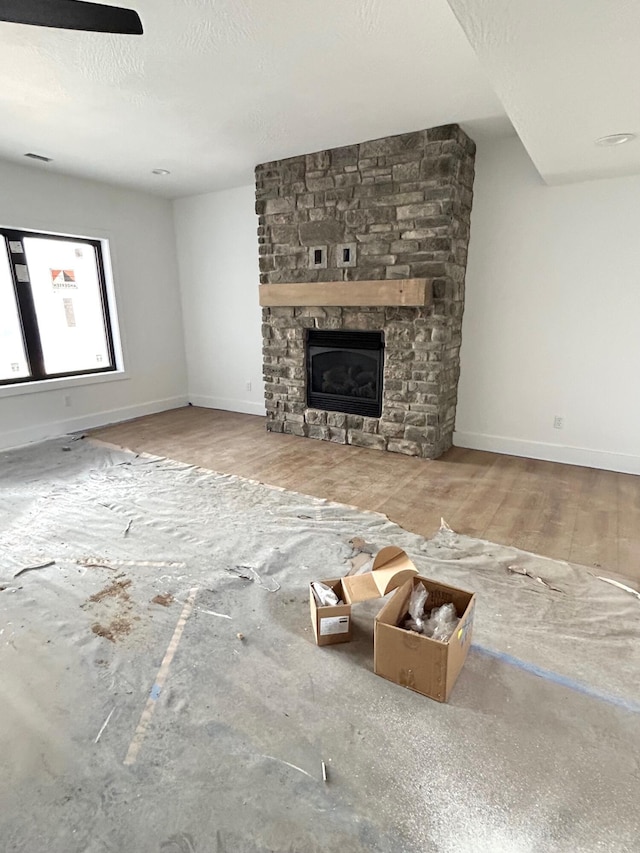 unfurnished living room featuring a fireplace