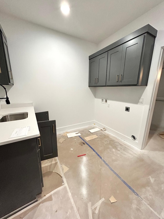 clothes washing area featuring cabinets, washer hookup, electric dryer hookup, and sink