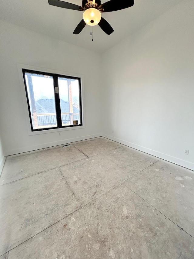 spare room with ceiling fan