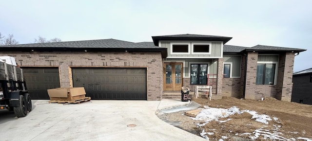 prairie-style home featuring a garage