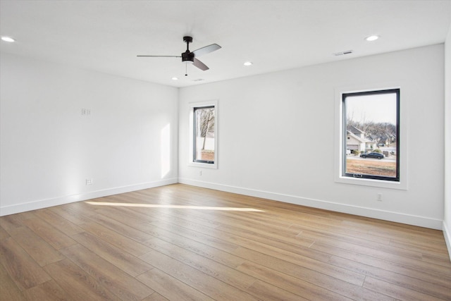 unfurnished room with light hardwood / wood-style flooring and ceiling fan