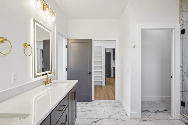 bathroom with vanity and a shower with shower door