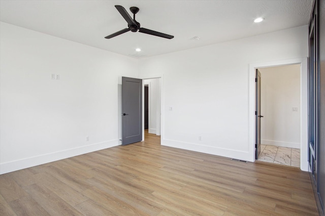 unfurnished bedroom featuring light hardwood / wood-style flooring and ceiling fan