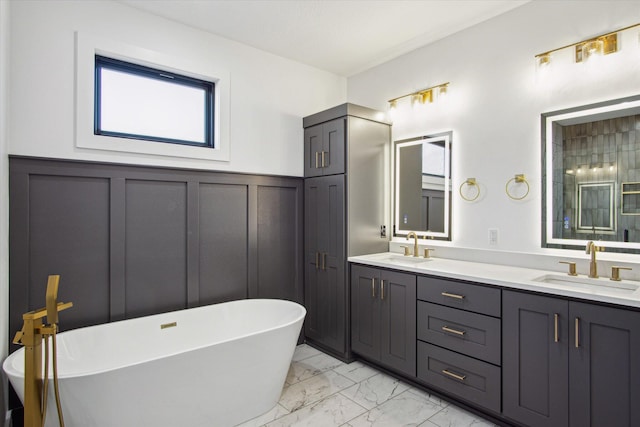 bathroom with vanity and a tub to relax in