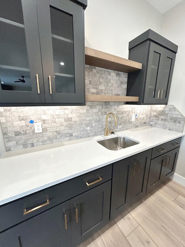 kitchen featuring decorative backsplash and sink