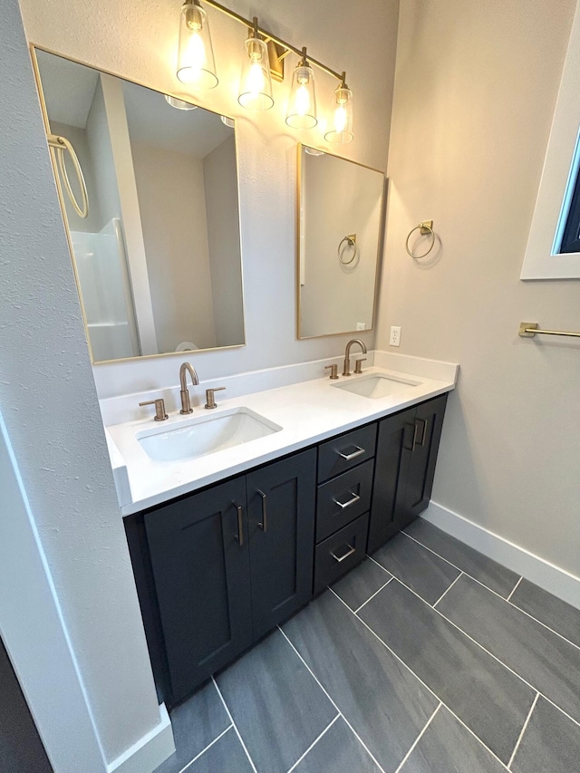 bathroom featuring tile patterned floors and vanity