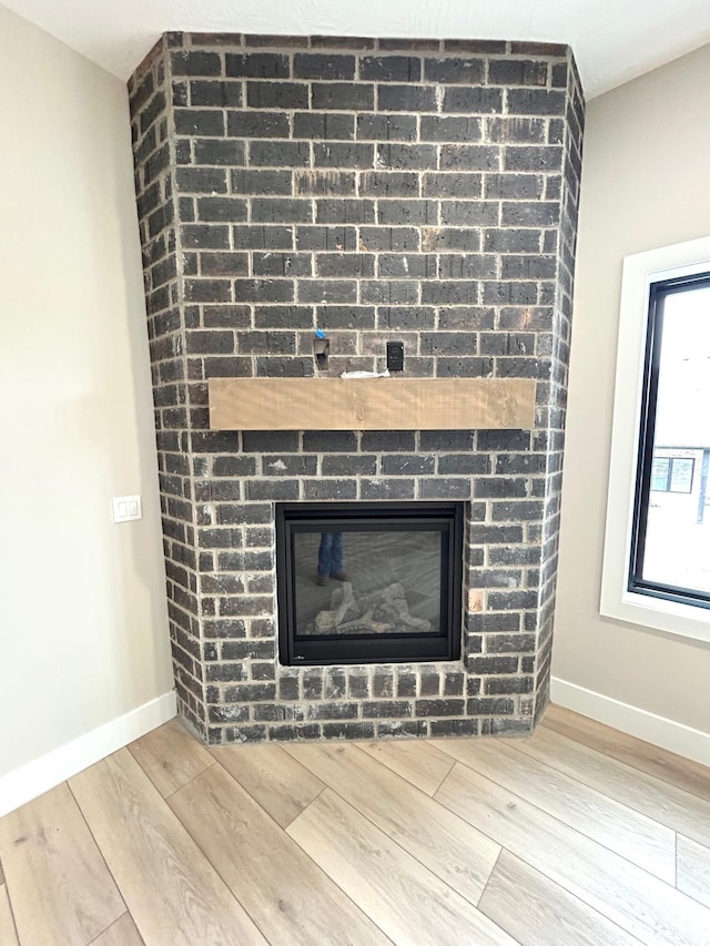 interior details with a brick fireplace