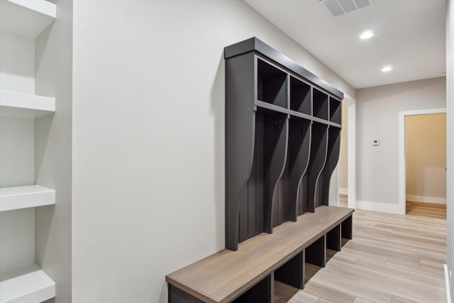 mudroom featuring recessed lighting, baseboards, light wood finished floors, and visible vents
