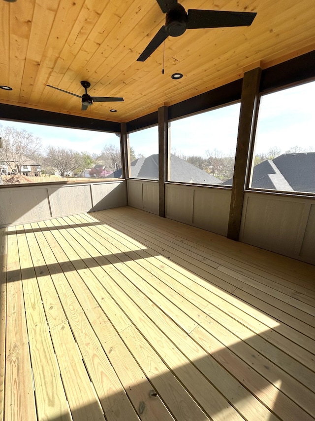 wooden terrace featuring ceiling fan