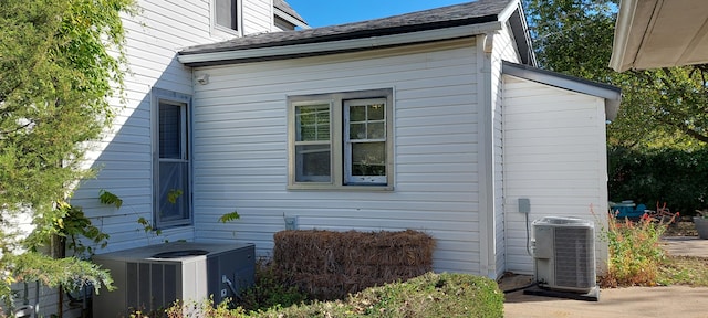 view of side of property with central AC unit