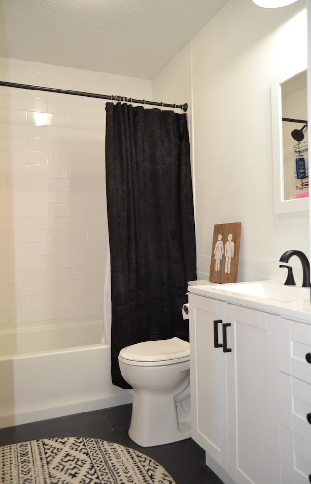 full bathroom featuring shower / bath combo with shower curtain, tile patterned flooring, vanity, and toilet