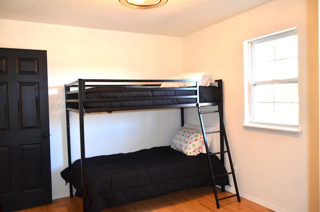 bedroom with wood-type flooring