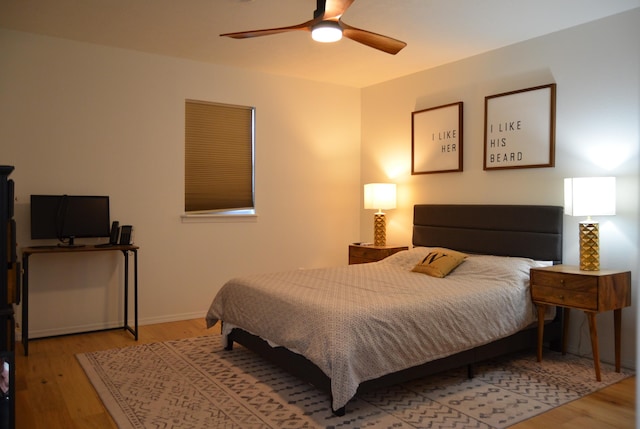 bedroom featuring hardwood / wood-style flooring and ceiling fan