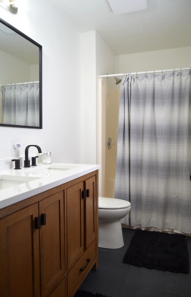 bathroom with vanity, tile patterned floors, toilet, and a shower with shower curtain