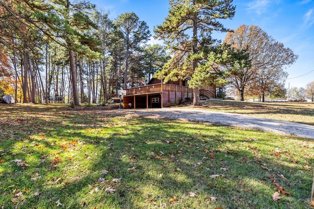 view of yard with a wooden deck