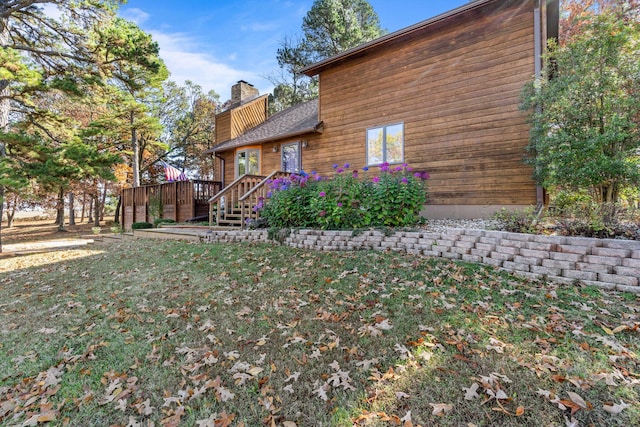 view of yard featuring a wooden deck