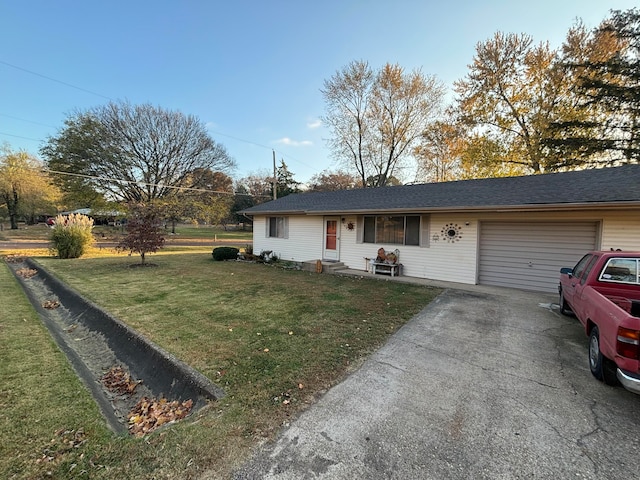 ranch-style house with a front yard and a garage