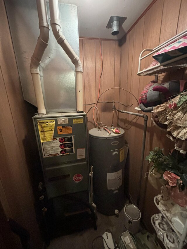 utility room with electric water heater and heating unit