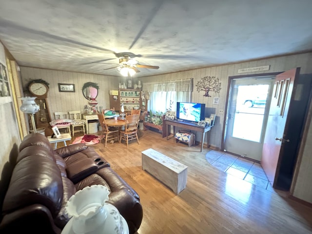 living room featuring hardwood / wood-style flooring and ceiling fan