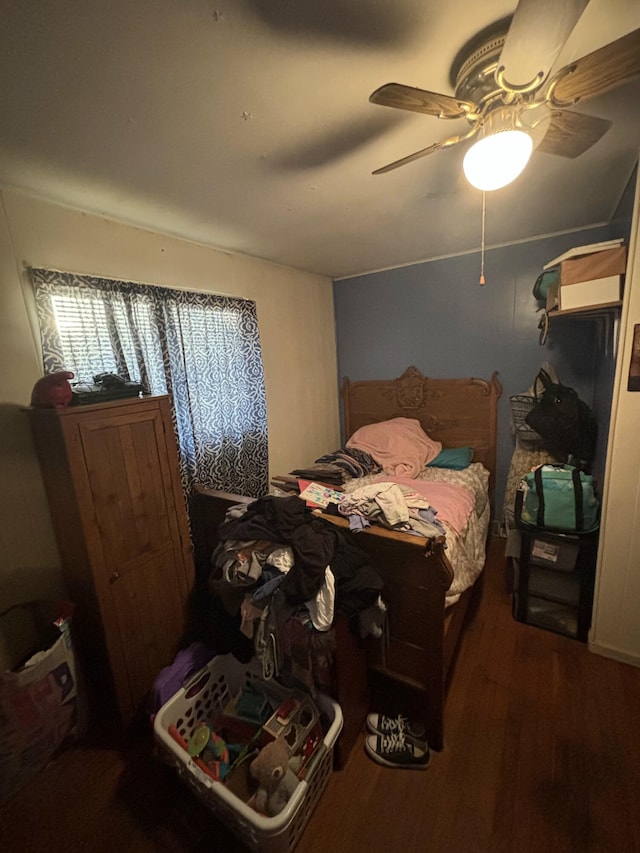 bedroom featuring dark wood-type flooring and ceiling fan