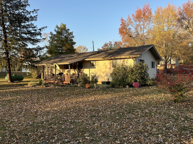 view of side of property featuring a porch