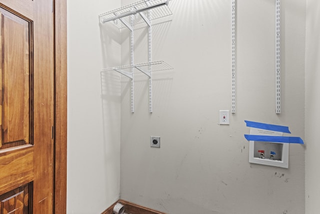 clothes washing area featuring hookup for an electric dryer and hookup for a washing machine