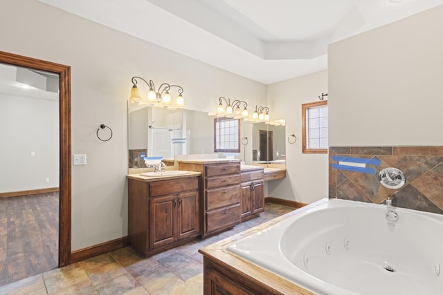 bathroom with a bathing tub, vanity, and hardwood / wood-style flooring