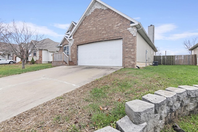 view of side of home featuring a yard, a garage, and central air condition unit