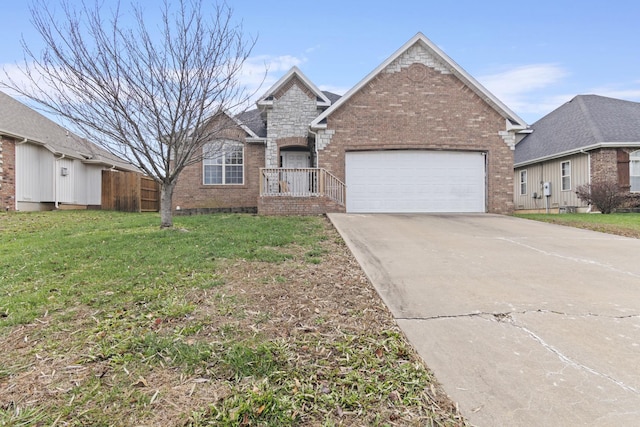 view of front of house with a front yard and a garage