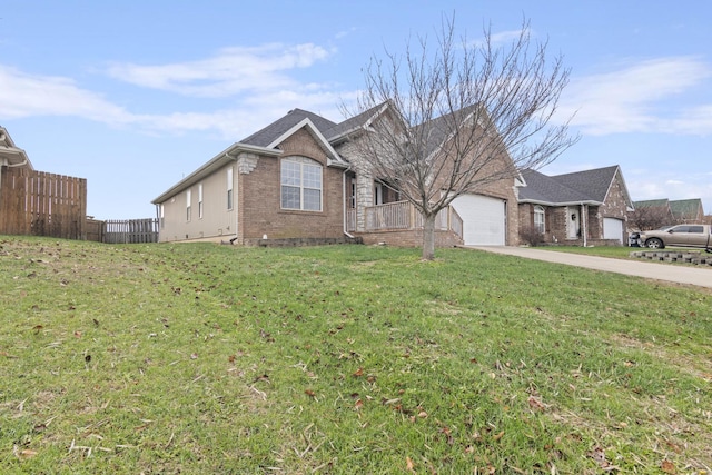 view of front of property featuring a garage and a front lawn