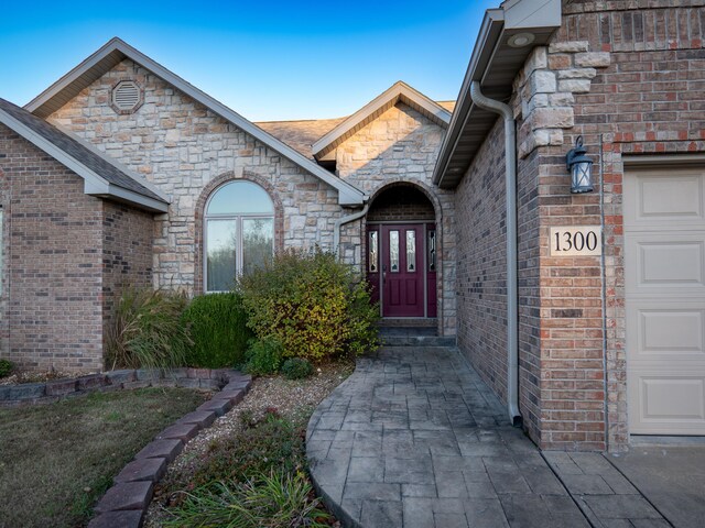 property entrance featuring a garage