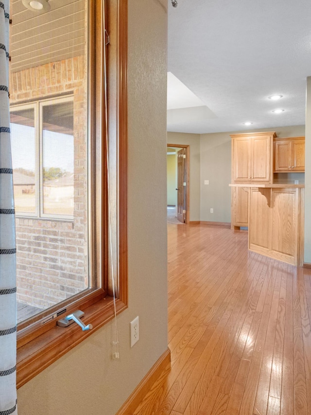 corridor featuring light hardwood / wood-style floors