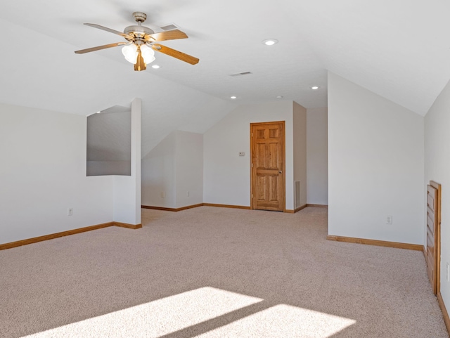 bonus room with lofted ceiling, light carpet, and ceiling fan