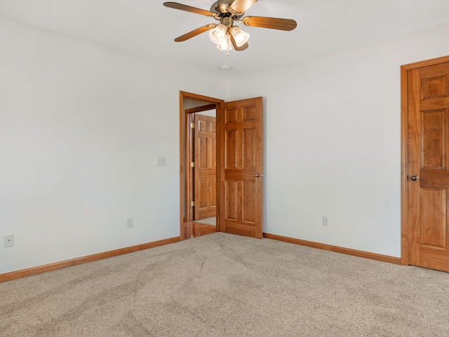 unfurnished room featuring carpet flooring and ceiling fan